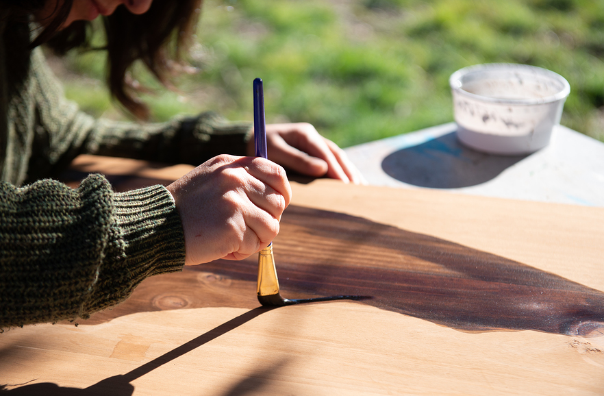 using acrylic paint on stained wood